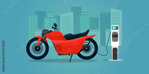 Red electric motorbike isolated. Electric motorbike is charging, side view. Vector flat illustration.