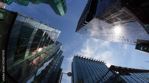 Timelapse of Fisheye view of offices at at midday with the sun passing overhead city life cityscape office
