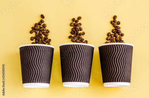paper coffee cup on a yellow background