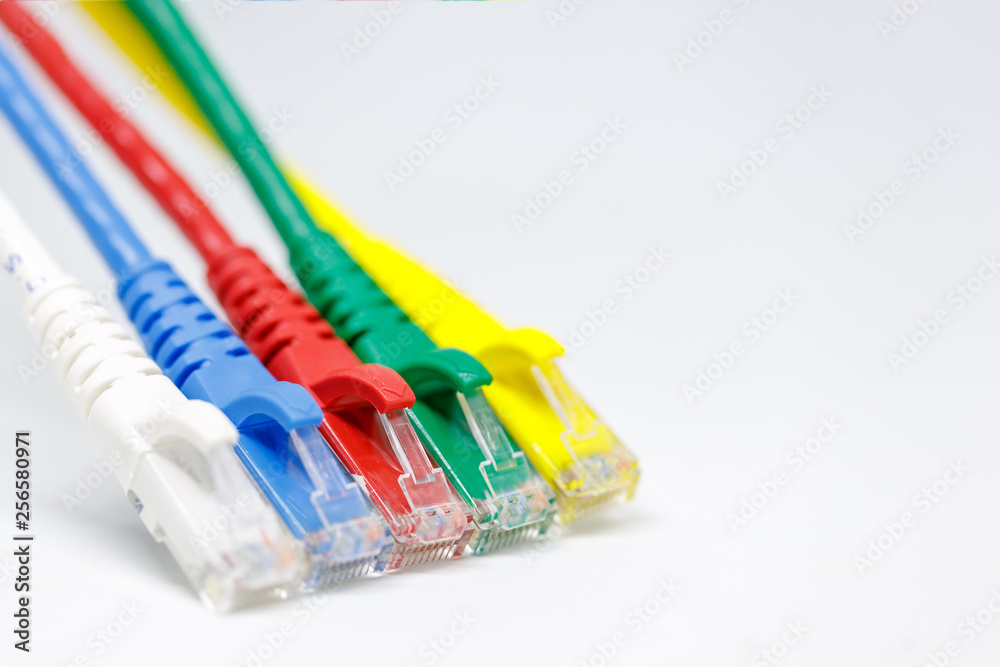 Close up multi coloured ethernet network cables  isolate on white background,Bunch of multi colored RJ45 cables,Spot focus.