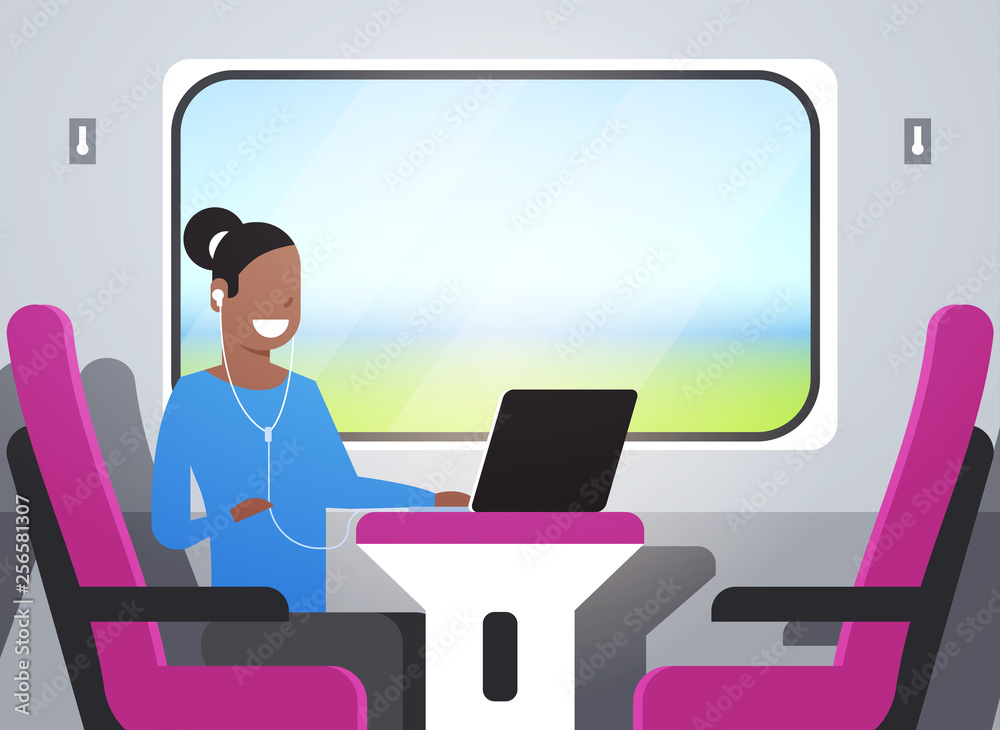 woman train passenger listening audio book with headphones african american girl sitting pink armchair railway traveling concept female character portrait horizontal