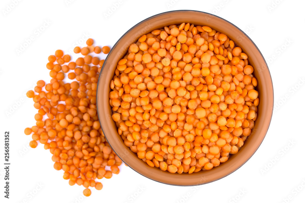 Red lentils in plate isolated on white background Red lentils in plate isolated on white background