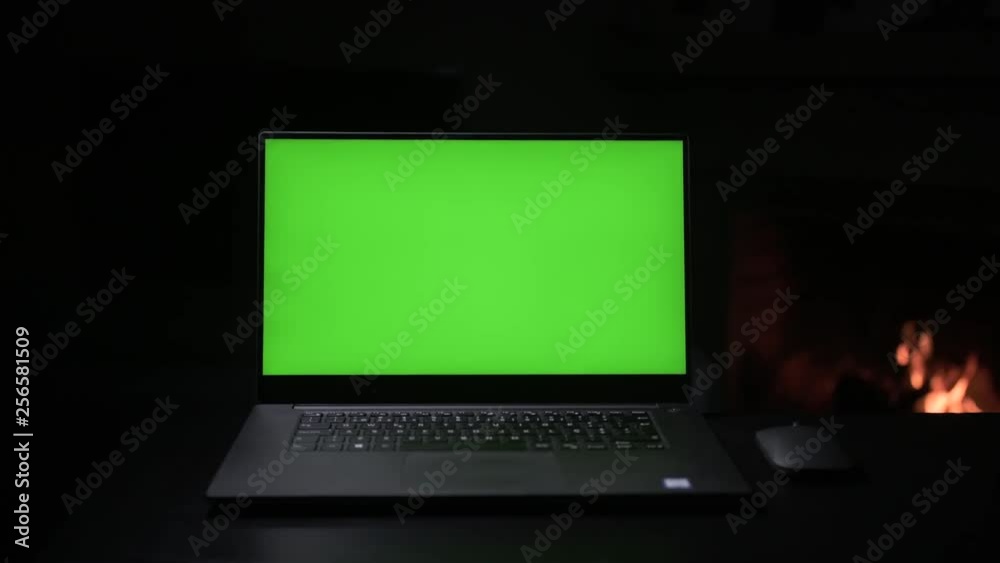 Laptop green screen with fireplace at the background. Slow motorized slide camera movement, captured at 4:2:2 10 bit ProRes for a better color accuracy and resolution Laptop green screen with fireplace at the background. Slow motorized slide camera movement, captured at 4:2:2 10 bit ProRes for a better color accuracy and resolution