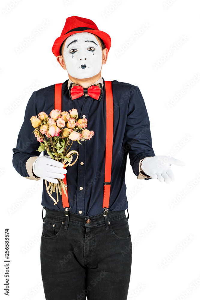MIM artist works and keeps dried roses isolated on white background. MIM artist works and keeps dried roses isolated on white background.