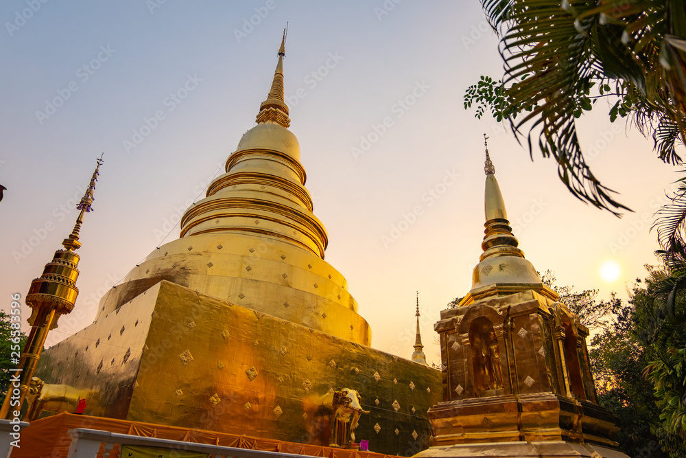 Naklejka premium golden pagada in old temple of Chiang Mai city, Thailand during beautiful sunlight 