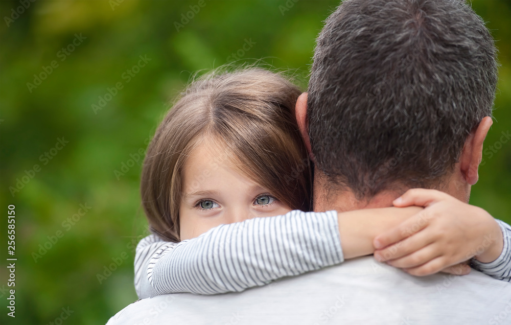 Portrait of one sad daughter hugging her father Portrait of one sad daughter hugging her father