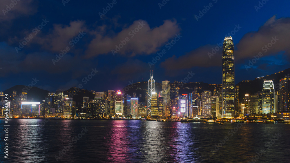 Cityscape and skyline at Victoria Harbour at sunset time. Popular view point of Hong Kong city at twilight time