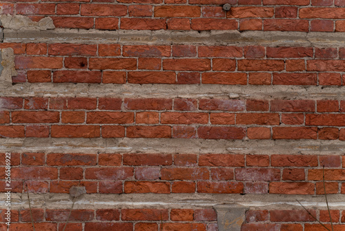 background texture of old red brick walls. Wallpaper or desktop design