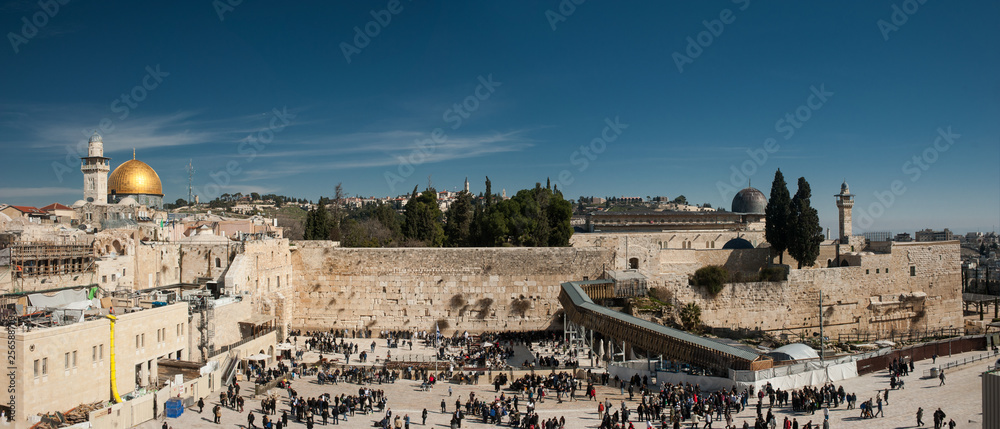 Fototapeta premium Wall of Tears. Panoramic view onto Western Wall of Jerusalem Temple and the dome of mosque Al Aqsa. The center of world's spiritual culture and the root of all modern cultural and political conflicts