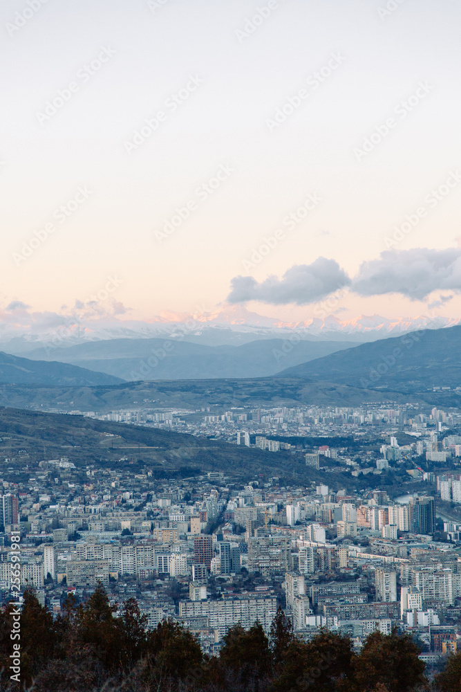 Sunset and evening city Tbilisi, Georgia. Panoramic views and lights of historic neighborhoods. Sunset and evening city Tbilisi, Georgia. Panoramic views and lights of historic neighborhoods.