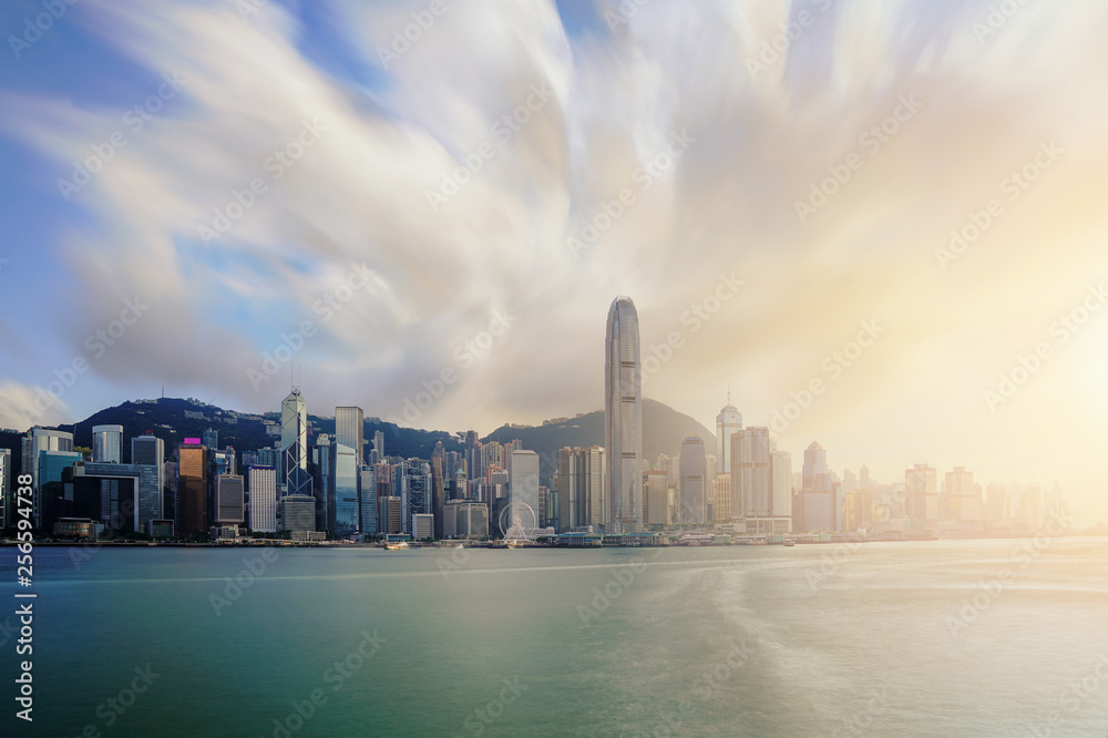 Obraz premium View of Victoria Harbour with Hong Kong skyscraper office buildings at sunset time in Hong Kong. Asia.
