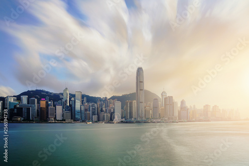 View of Victoria Harbour with Hong Kong skyscraper office buildings at sunset time in Hong Kong. Asia. © ake1150