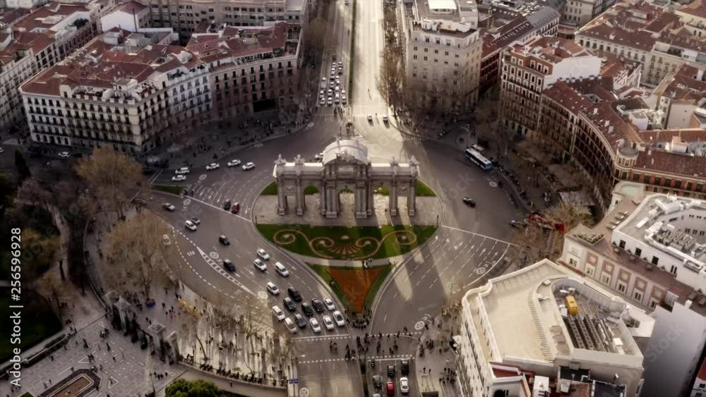 The Puerta de Alcalá in Madrid, Spain. Light traffic around the sight in the city