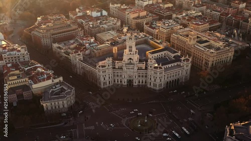 Madrid with its famous Palacio de Cibeles at the Plaza de Cibeles in an aerial shot.  photo