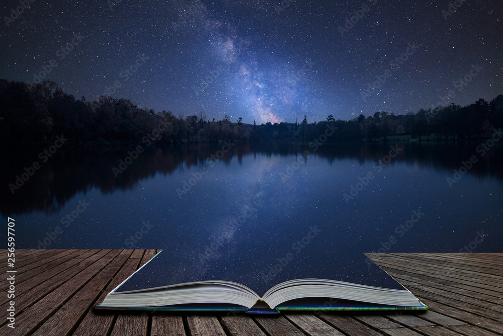 Vibrant Milky Way composite image over landscape of still lake coming out of pages in magical story book - obrazy, fototapety, plakaty 