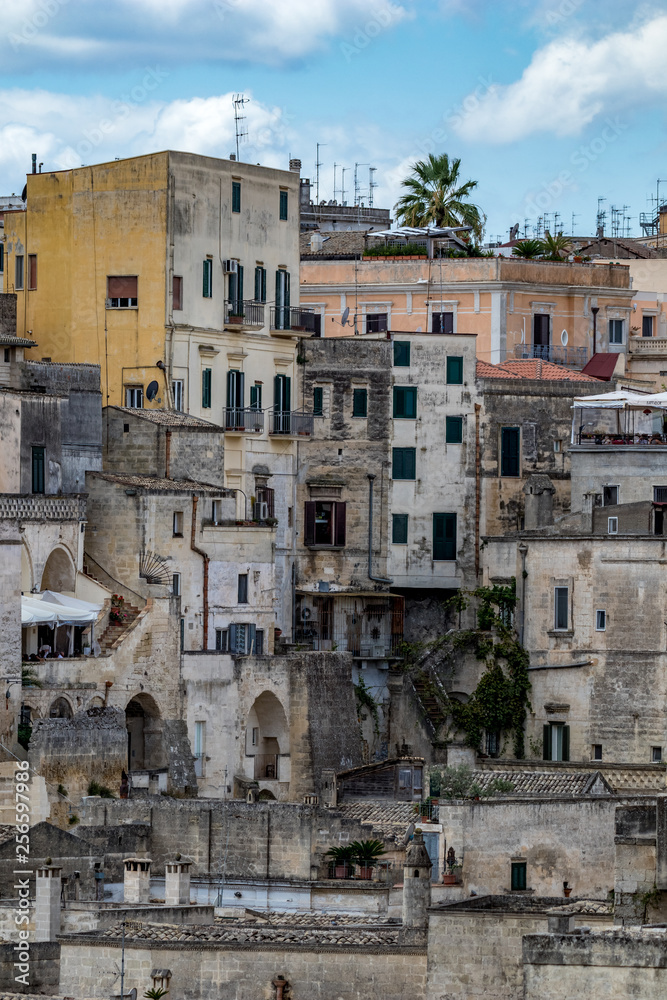 Amazing close-up vertical layered view of ancient town of Matera, the Sassi di Matera, Basilicata, Southern Italy, architectural details and buildings on many levels