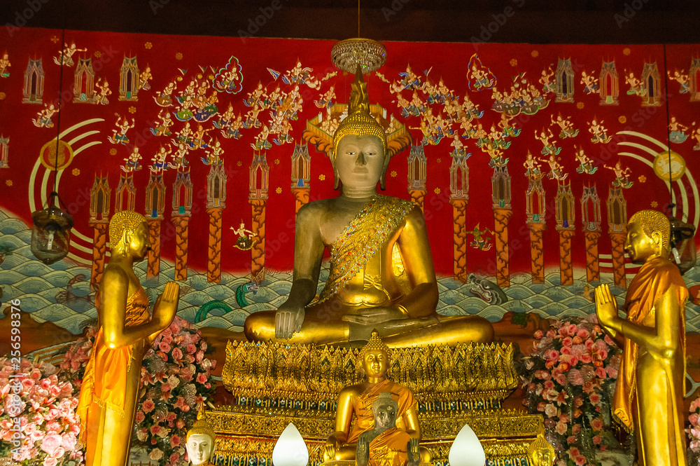 Golden Buddha of Wat Mahathat in Ayutthaya, Thailand. Landmark Historical temple in Thailand with sunset twilight.