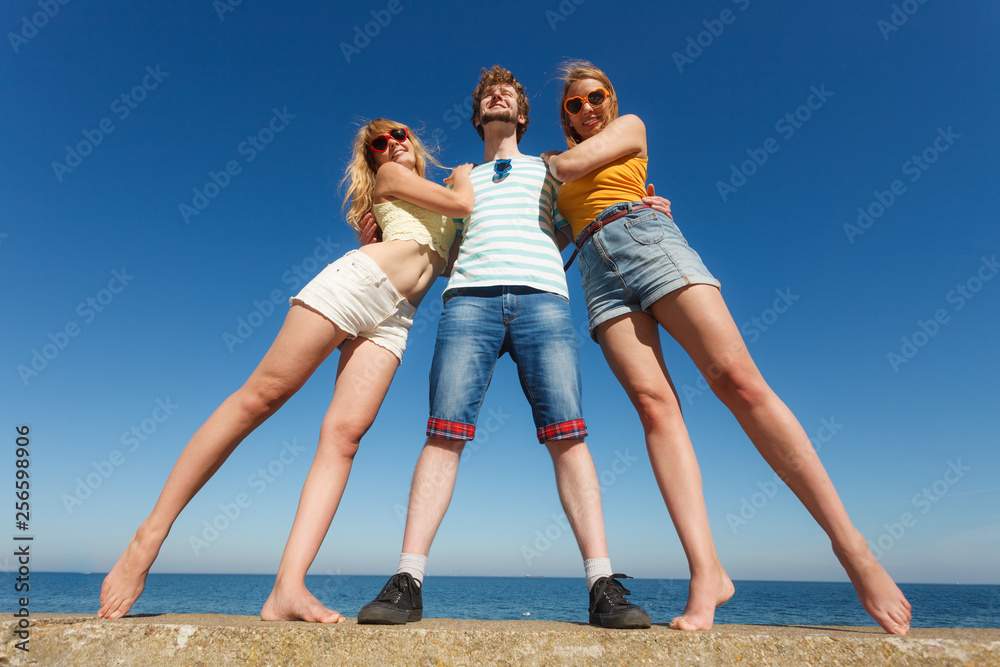 Group friends boy two girls having fun outdoor Group friends boy two girls having fun outdoor