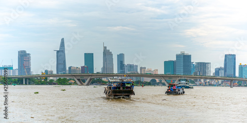 Ho Chi Minh City, Vietnam - June 12, 2018: Skyscrapers viewed from riverside with dramatic sky showing urban development with modern architecture to bring international in Ho Chi Minh City, Vietnam © huythoai