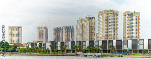 Ho Chi Minh City, Vietnam - June 12th, 2018: Architecture riverside urban with skyscrapers thousands of luxury apartments inside demonstrating urban economic development in Ho Chi Minh City, Vietnam
