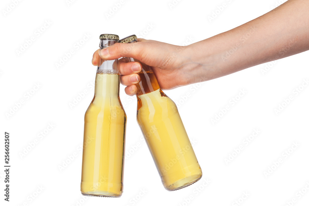 Hand holding a beer bottle without label isolated on white background Hand holding a beer bottle without label isolated on white background