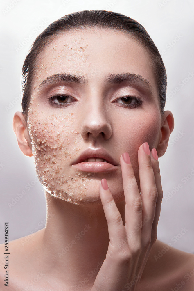 Woman spa mask half-face beauty concept. Salt granule. Studio portrait Woman spa mask half-face beauty concept. Salt granule. Studio portrait