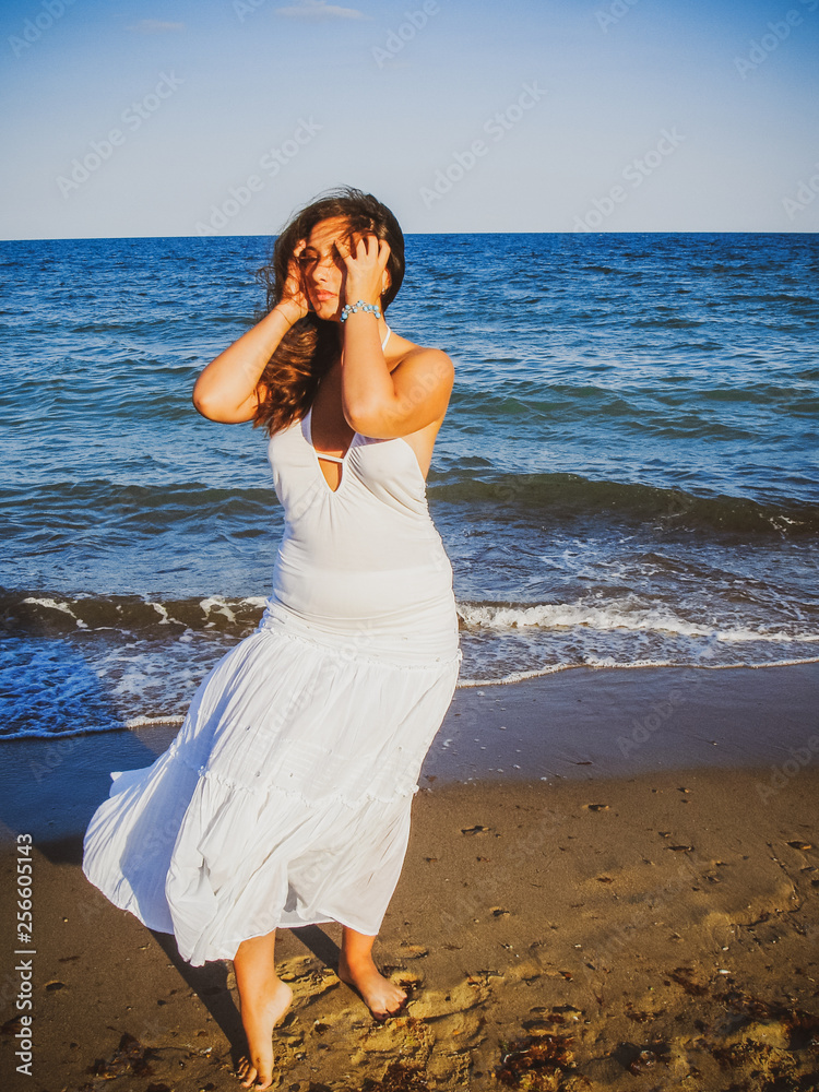 Plus size hispanic woman at sea. Young woman with overweight at vacation Plus size hispanic woman at sea. Young woman with overweight at vacation