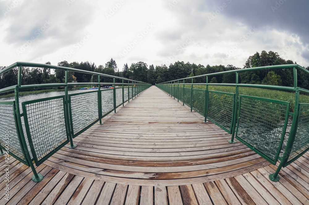 Fototapeta premium Wooden pier on Lanskie Lake located in Olsztyn Lake District, near the village of Lansk in Warmian-Masurian Voivodeship of Poland