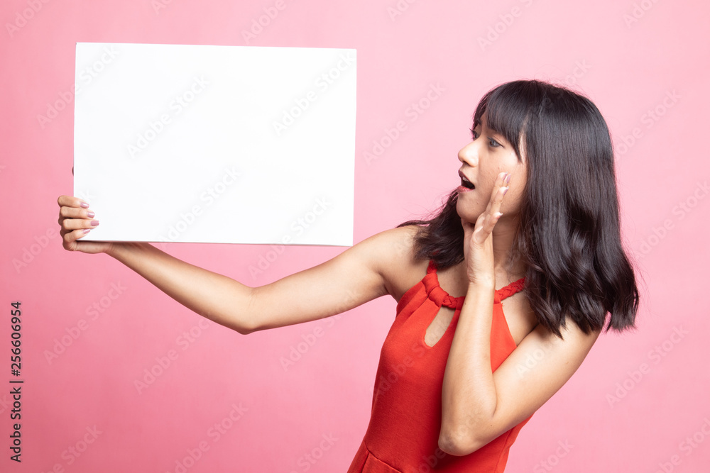 Young Asian woman surprise with white blank sign. Young Asian woman surprise with white blank sign.
