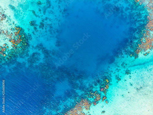 Aerial top down coral reef tropical caribbean sea, turquoise blue water. Indonesia Banyak Islands Sumatra, tourist diving travel destination.