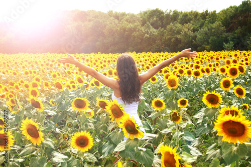 Happy young women on nature, in a field of sunflowers, lifestyle, summer