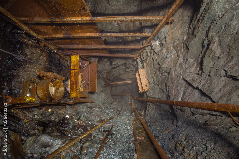 Undeground gold mine tunnel drift with rails