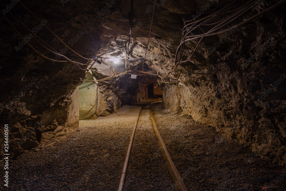 Naklejka premium Undeground gold mine tunnel drift with rails