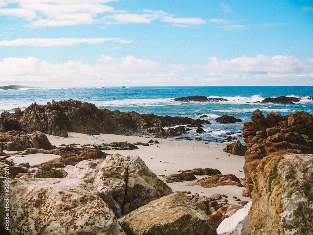 Coastal California view with rock outcrop. Rocky California coastal view. Beautiful rock outcropping with a stunning blue ocean and sky