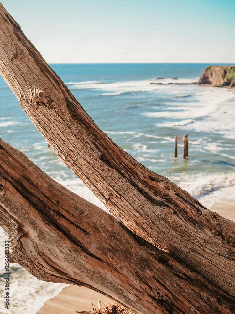 Abandoned Pier Pillar near Davenport, California. Abandoned Pier Pillar near Davenport, California, with tide waves lit at Sunset