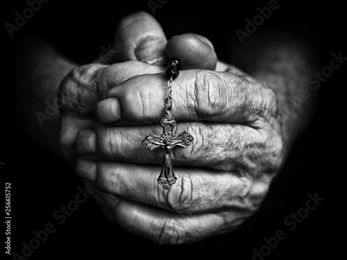 Rosary in praying hands