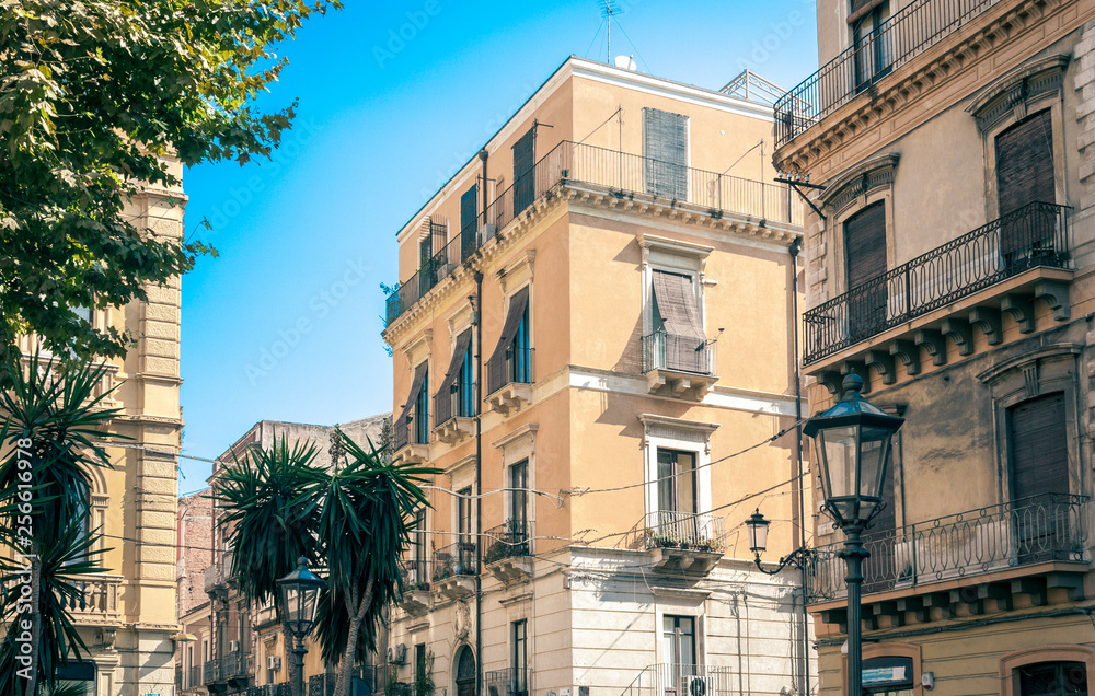 Beautiful cityscape of Italy, historical street of Catania, Sicily, facade of old buildings.