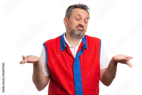 Ignorant hypermarket employee making gesture with palms.