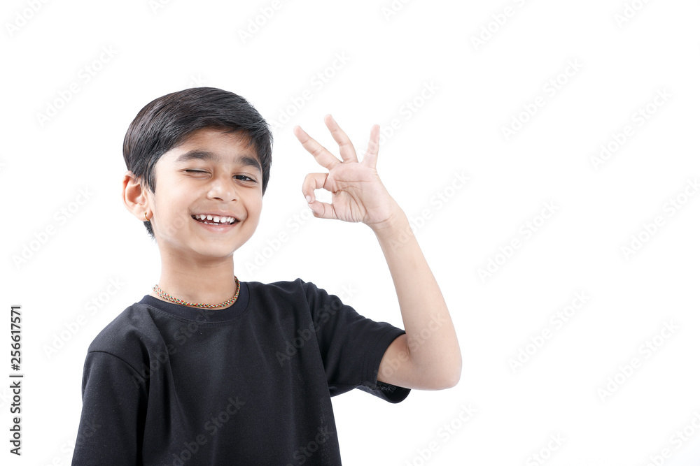 Indian child showing nice gesture with hand Indian child showing nice gesture with hand