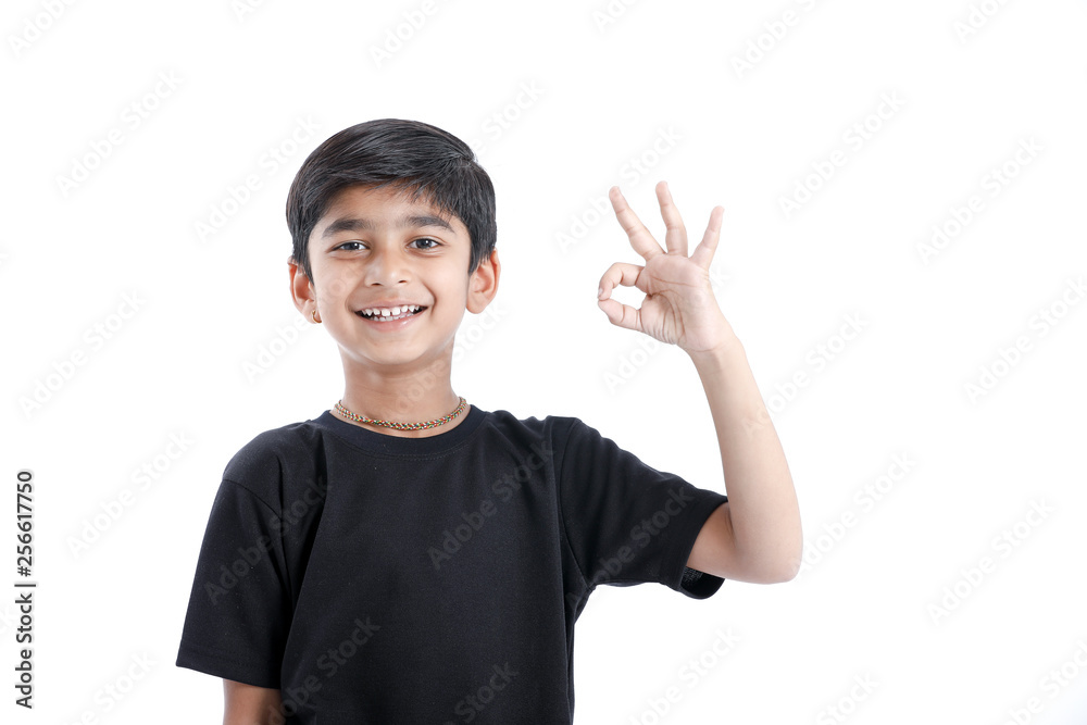 Indian child showing nice gesture with hand Indian child showing nice gesture with hand