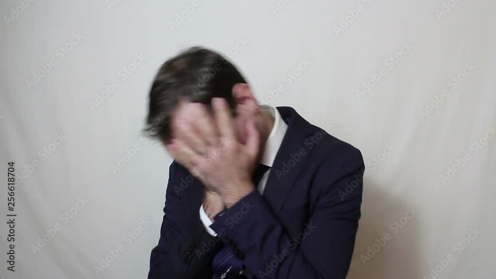 Young handsome businessman in despair beats hand on the forehead.Portrait on white background. Young handsome businessman in despair beats hand on the forehead.Portrait on white background.