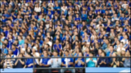 Blurred motion of people at  stadium