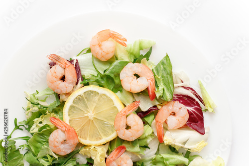 delicious shrimp with salad and lemon