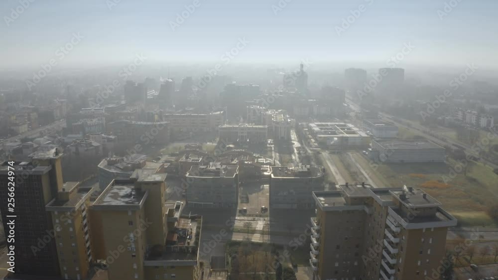 Aerial view of the apartment houses in Modena on foggy day. Emilia-Romagna region, Italy Aerial view of the apartment houses in Modena on foggy day. Emilia-Romagna region, Italy