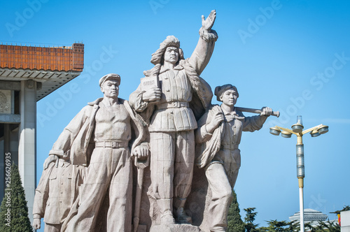 Revolutionary monument in front of Mao's Mausoleum on Tiananmen Square in Beijing, China photo