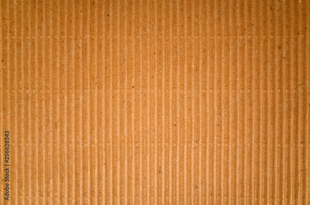 Brown corrugated cardboard paper background with Vertical Lines Brown corrugated cardboard paper background with Vertical Lines