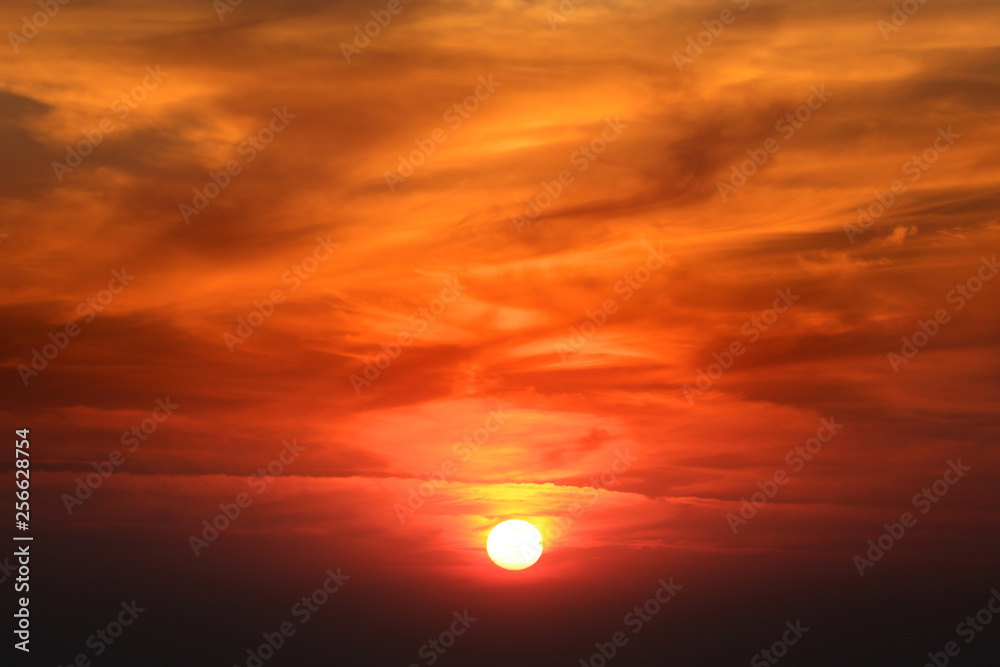 Sun set and bright orange cloudy sky Sun set and bright orange cloudy sky