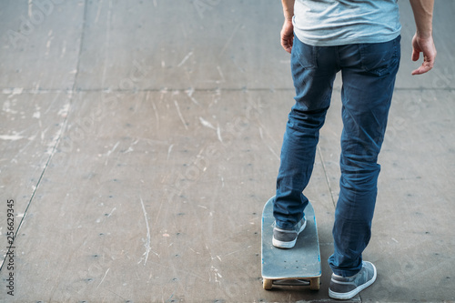 Wallpaper Mural Youth hobby and lifestyle. Leisure and practice. Man with skateboard. Skate park ramp. Cropped shot backview. Copy space. Torontodigital.ca