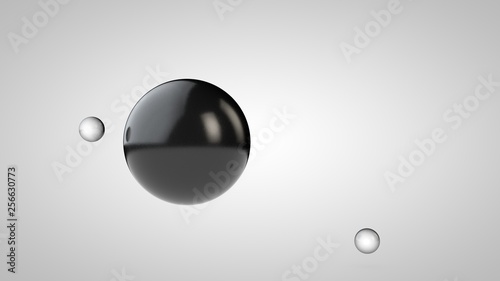 3D illustration of black balls, one large and two small balls. spheres in the air, isolated on a white background. 3D rendering of an abstraction. Space with geometric objects.