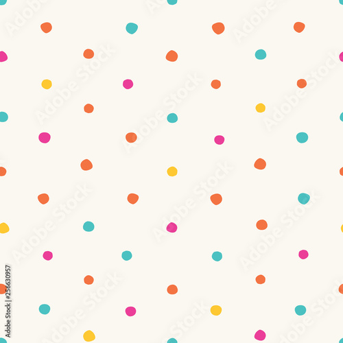 Colorful irregular polka dots vector seamless pattern. Trendy seamless pattern. Pink, yellow, orange, turquoise circles on white background. Vector illustration. Surface pattern design.